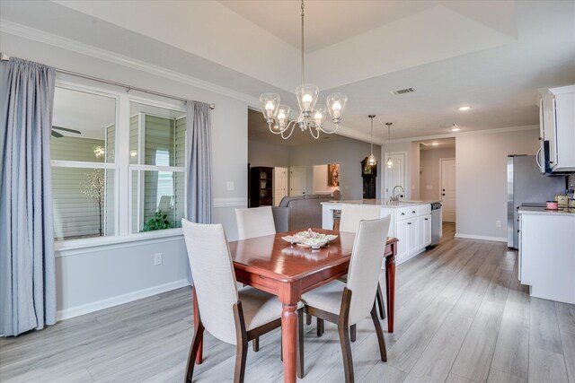 4932 Fairmont Dr, Graniteville, SC 29829 - dining area with crown molding, baseboards, a chandelier, and light wood-style flooring