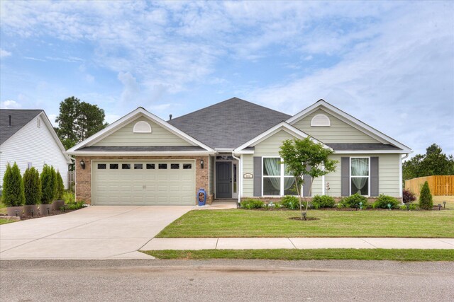 4932 Fairmont Dr, Graniteville, SC 29829 - view of front of house featuring concrete driveway, brick siding, a front yard, and a garage