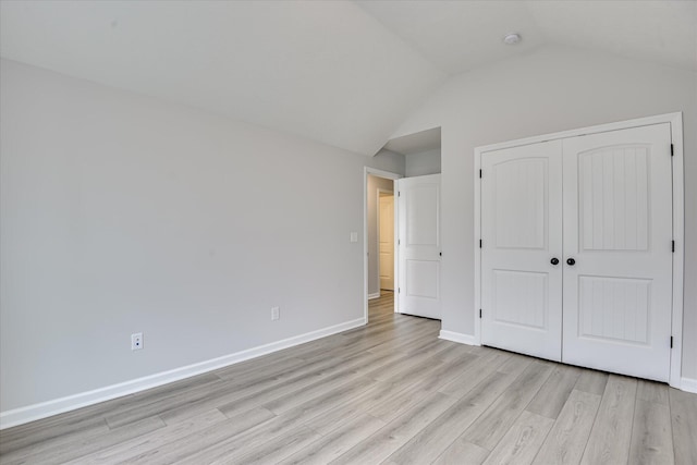 4932 Fairmont Dr, Graniteville, SC 29829 - unfurnished bedroom with baseboards, a closet, light wood finished floors, and lofted ceiling