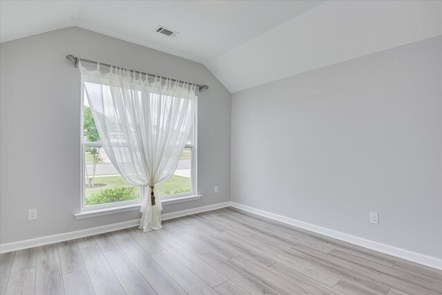 4932 Fairmont Dr, Graniteville, SC 29829 - empty room with baseboards, visible vents, wood finished floors, and lofted ceiling