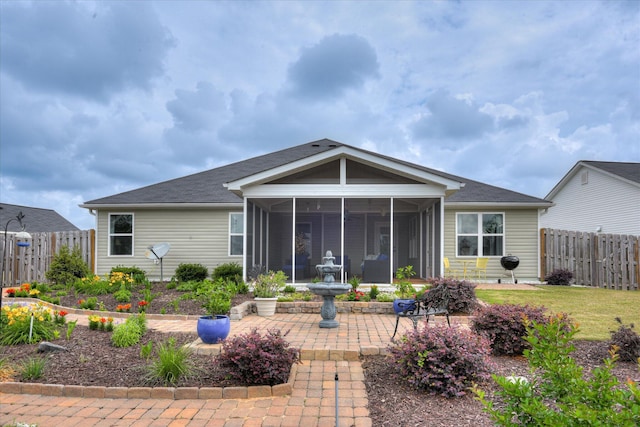 4932 Fairmont Dr, Graniteville, SC 29829 - back of property with roof with shingles, a fenced backyard, a patio area, and a sunroom