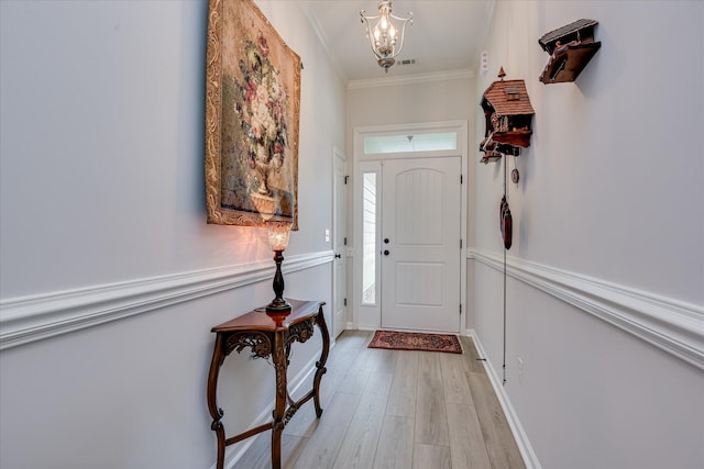 4932 Fairmont Dr, Graniteville, SC 29829 - doorway to outside featuring a chandelier, ornamental molding, and light wood-style floors