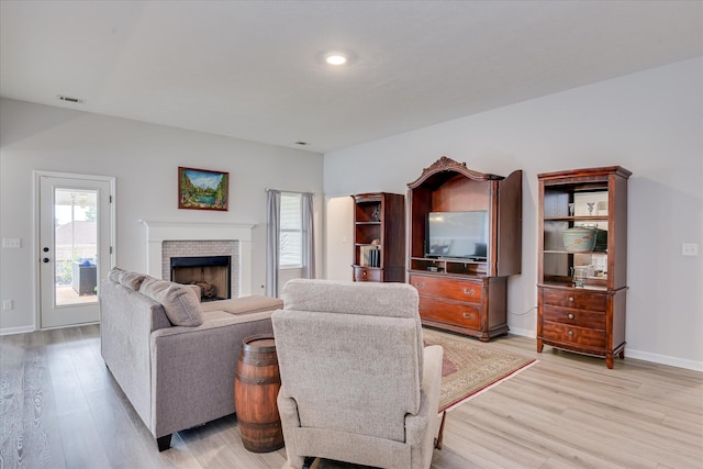 4932 Fairmont Dr, Graniteville, SC 29829 - living area with light wood-style floors, baseboards, visible vents, and a fireplace