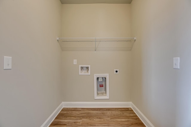 washroom with laundry area, baseboards, wood finished floors, hookup for a washing machine, and electric dryer hookup