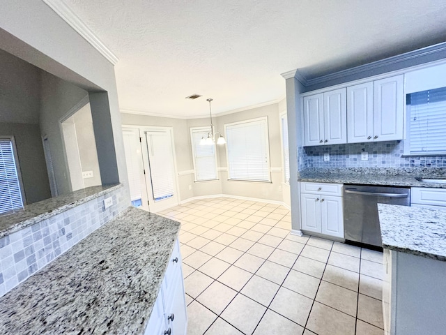 kitchen featuring stainless steel dishwasher, a chandelier, a textured ceiling, decorative backsplash, and white cabinets