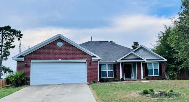 view of front of house featuring a front lawn and a garage