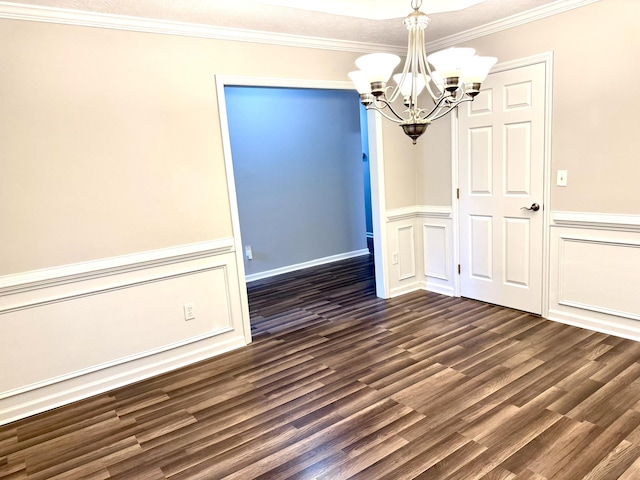 unfurnished dining area with dark hardwood / wood-style floors, an inviting chandelier, and crown molding