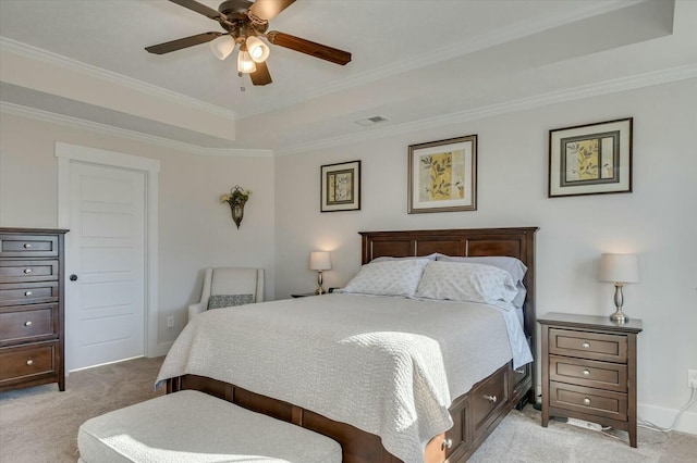 carpeted bedroom featuring crown molding, a raised ceiling, and ceiling fan