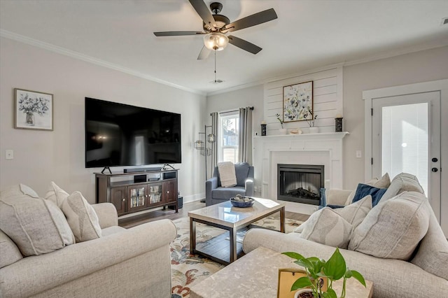 living room featuring crown molding, ceiling fan, and hardwood / wood-style flooring