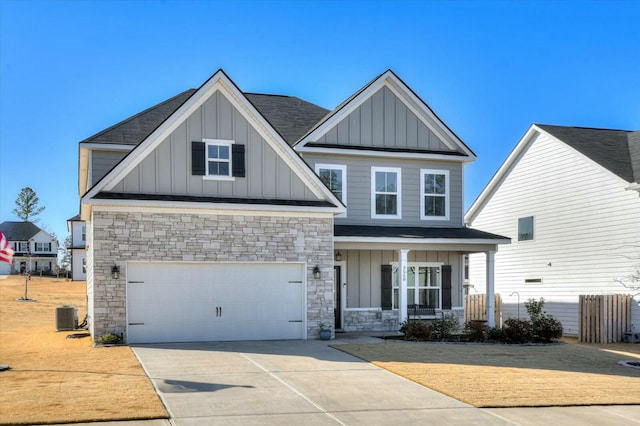 craftsman house featuring central AC, a garage, and covered porch