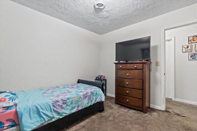3639 Massoit Dr, Augusta, GA 30906 - carpeted bedroom with baseboards and a textured ceiling