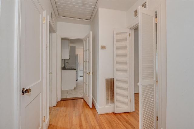 2336 Redwood Dr, Augusta, GA 30904 - hallway featuring light wood-type flooring and a sink