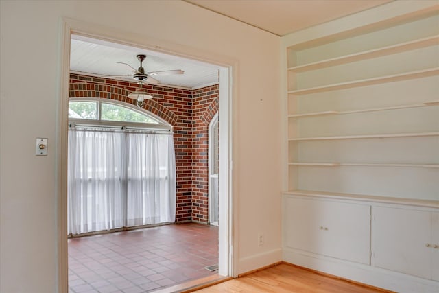 2336 Redwood Dr, Augusta, GA 30904 - empty room featuring built in shelves, baseboards, and ceiling fan