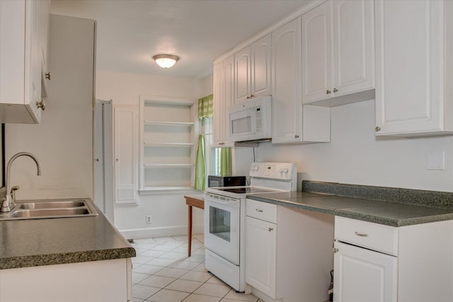 2336 Redwood Dr, Augusta, GA 30904 - kitchen with white appliances, a sink, dark countertops, and white cabinets
