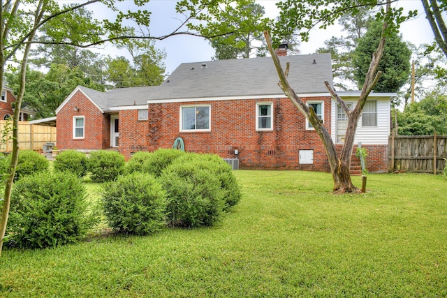 2336 Redwood Dr, Augusta, GA 30904 - rear view of property featuring brick siding, a chimney, and central AC unit