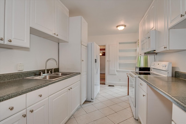 2336 Redwood Dr, Augusta, GA 30904 - kitchen with white appliances, a sink, dark countertops, white cabinetry, and light tile patterned flooring