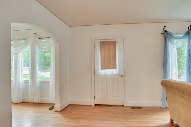 2336 Redwood Dr, Augusta, GA 30904 - foyer entrance featuring light wood-style floors, healthy amount of natural light, and arched walkways