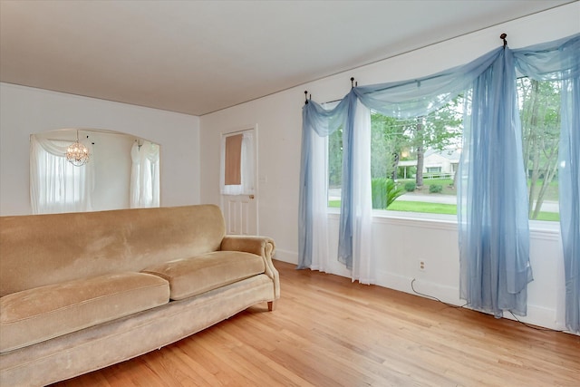 2336 Redwood Dr, Augusta, GA 30904 - living area featuring a chandelier, light wood-style floors, plenty of natural light, and arched walkways
