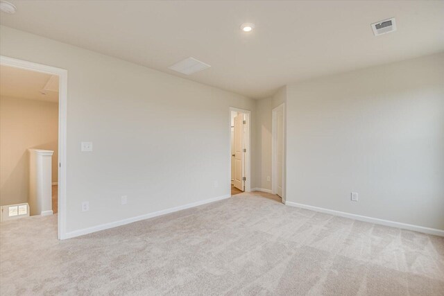 empty room with light colored carpet