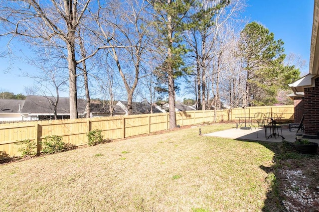 view of yard with a fenced backyard and a patio