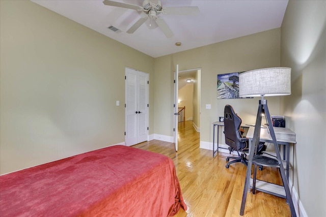 bedroom with ceiling fan and hardwood / wood-style floors