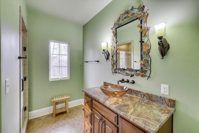 bathroom with walk in shower and vanity