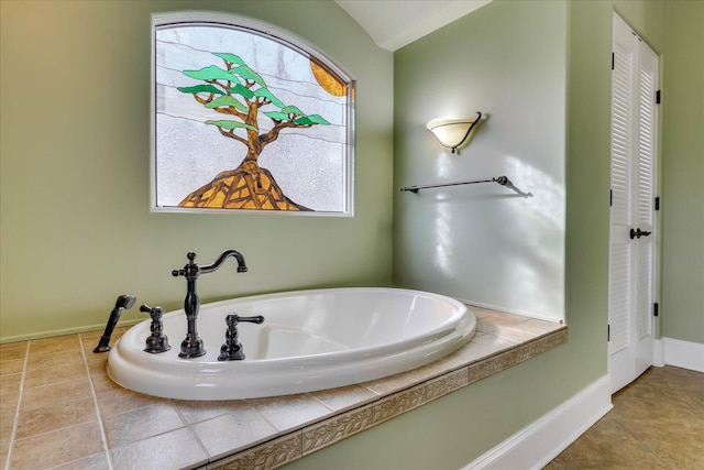 bathroom featuring a tub to relax in and tile patterned floors