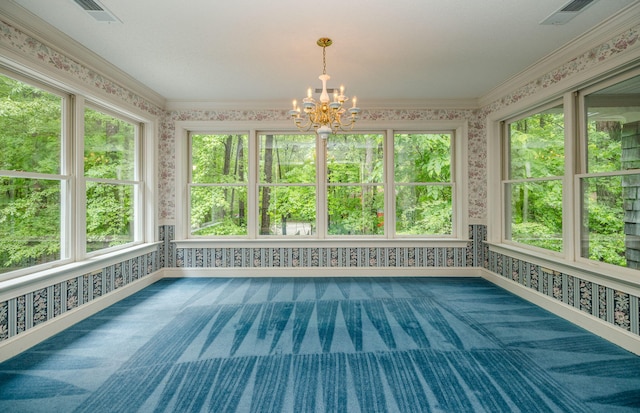 unfurnished sunroom featuring a notable chandelier and plenty of natural light