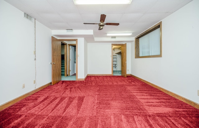 spare room featuring ceiling fan and carpet floors