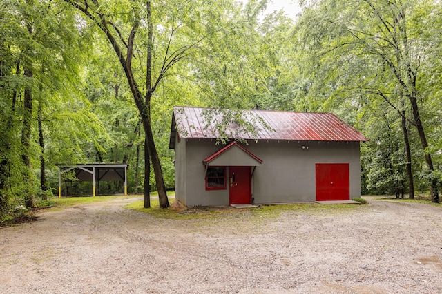 view of outdoor structure with a carport