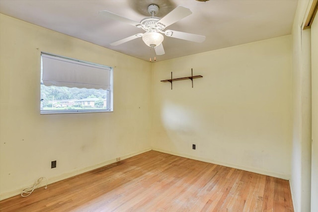 spare room with ceiling fan and light hardwood / wood-style floors