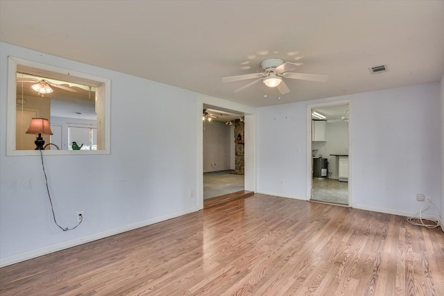 spare room featuring light hardwood / wood-style floors