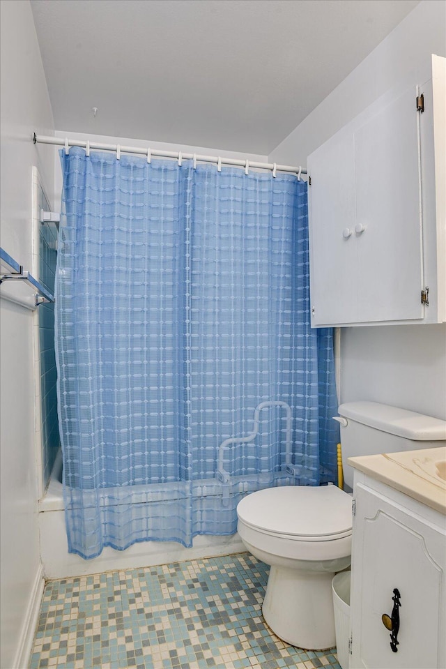 full bathroom with tile patterned flooring, vanity, shower / tub combo with curtain, and toilet