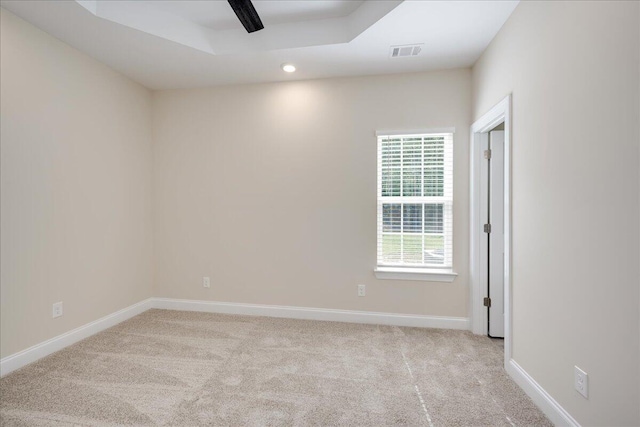 4921 Mossycup Ct, Hephzibah, GA 30815 - spare room with carpet, a ceiling fan, a tray ceiling, and recessed lighting