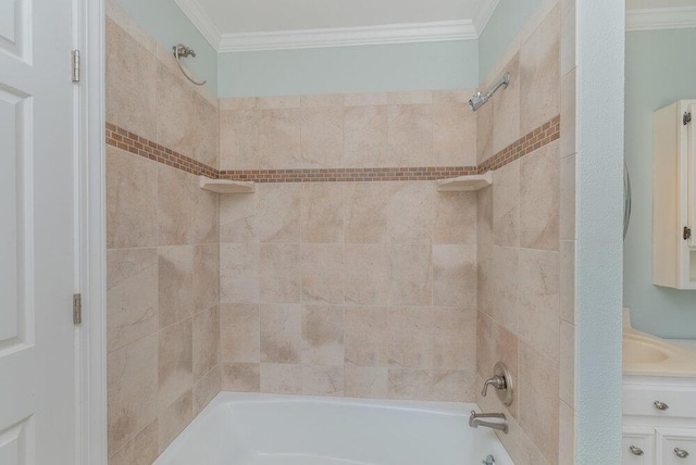 bathroom with vanity, crown molding, and bathtub / shower combination