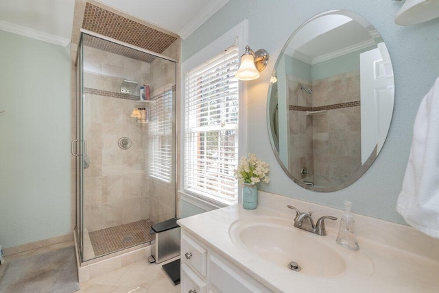 bathroom featuring a shower stall, vanity, and ornamental molding