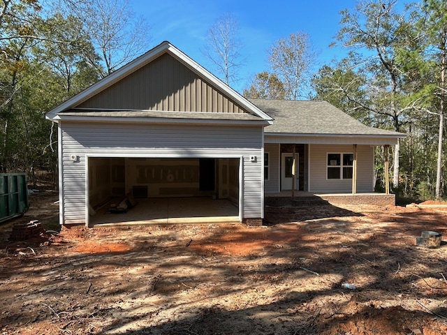 view of front of home with a garage and covered porch