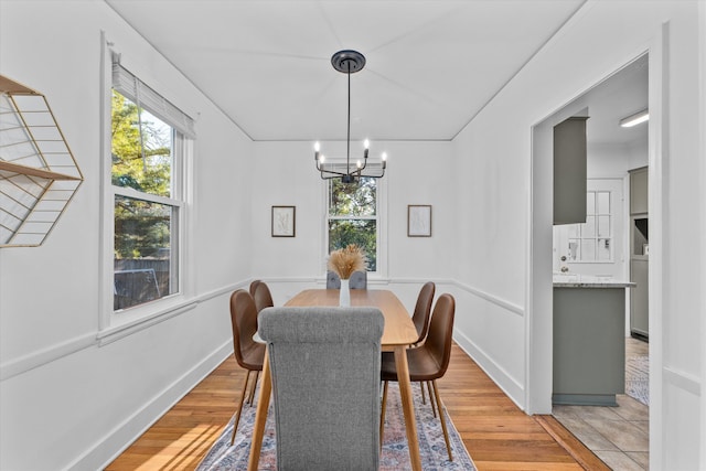 1738 Kissingbower Rd, Augusta, GA 30904 - dining room featuring a chandelier, healthy amount of natural light, and light wood finished floors