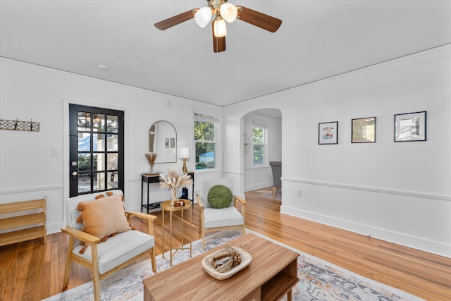 1738 Kissingbower Rd, Augusta, GA 30904 - living area with arched walkways, ceiling fan, and wood finished floors
