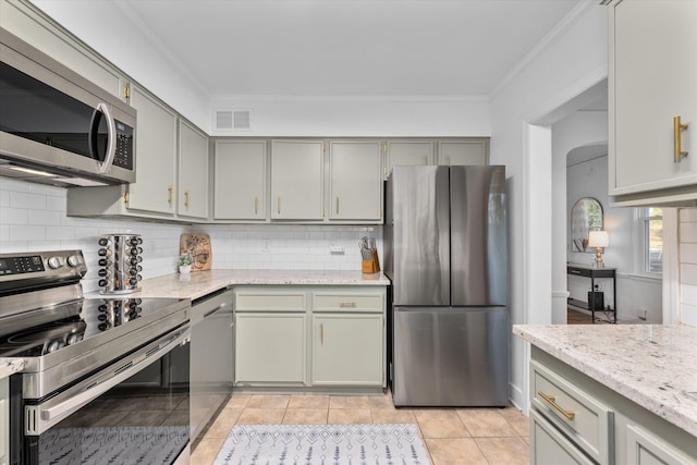 1738 Kissingbower Rd, Augusta, GA 30904 - kitchen featuring appliances with stainless steel finishes, crown molding, decorative backsplash, gray cabinets, and light tile patterned flooring