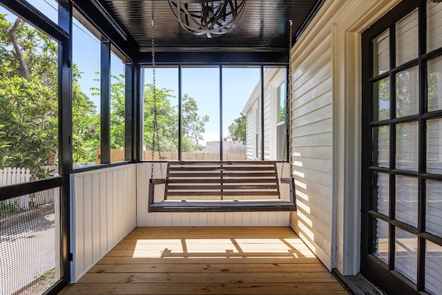 1738 Kissingbower Rd, Augusta, GA 30904 - unfurnished sunroom featuring a chandelier