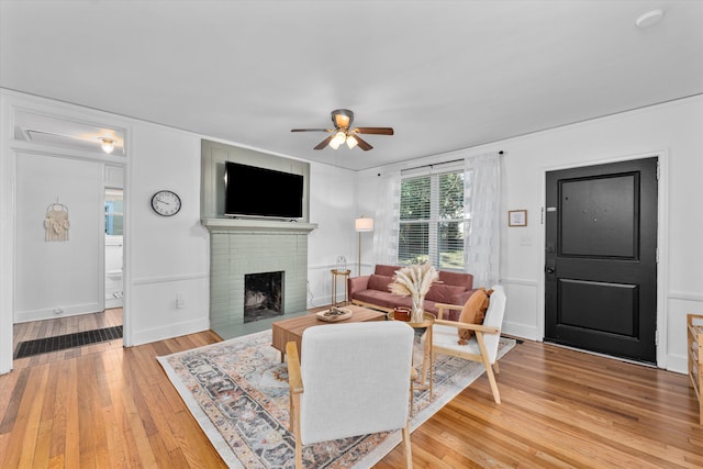 1738 Kissingbower Rd, Augusta, GA 30904 - living area featuring a ceiling fan, a brick fireplace, and light wood finished floors