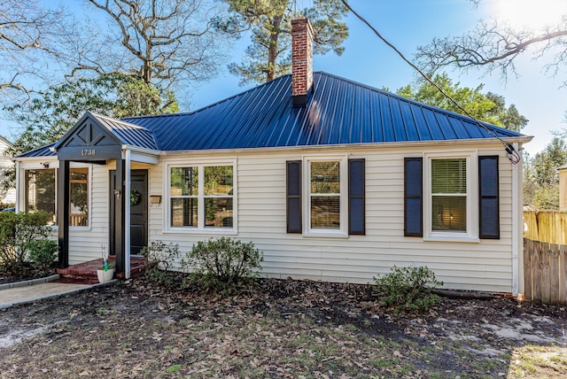 1738 Kissingbower Rd, Augusta, GA 30904 - view of front of home featuring a metal roof and a chimney