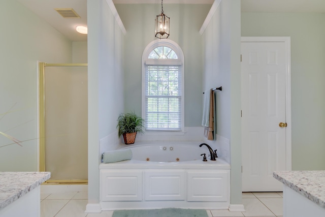 bathroom with a shower stall, visible vents, a wealth of natural light, and vanity