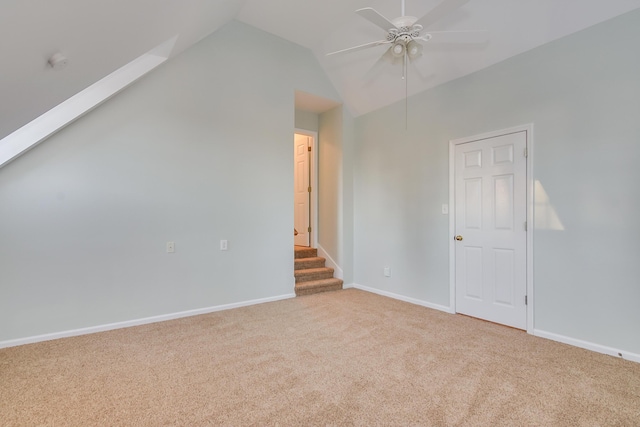 bonus room featuring carpet, vaulted ceiling, ceiling fan, baseboards, and stairs