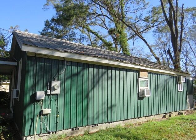 view of side of property with cooling unit