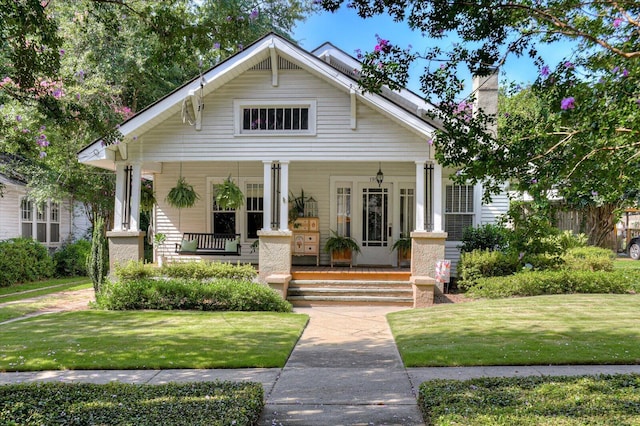 1958 Mcdowell St, Augusta, GA 30904 - view of front facade with a porch and a front yard