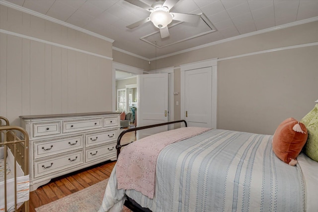 1958 Mcdowell St, Augusta, GA 30904 - bedroom with attic access, wood finished floors, a ceiling fan, and ornamental molding
