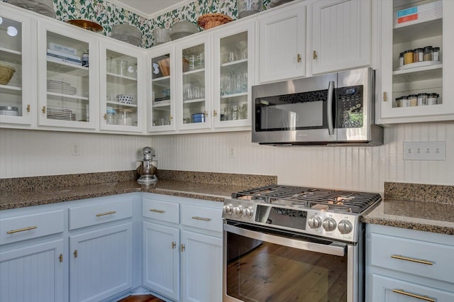 1958 Mcdowell St, Augusta, GA 30904 - kitchen with stainless steel appliances, glass insert cabinets, and white cabinets
