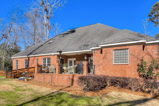 3218 Ramsgate Rd, Augusta, GA 30909 - rear view of house with brick siding, a yard, a shingled roof, and a wooden deck